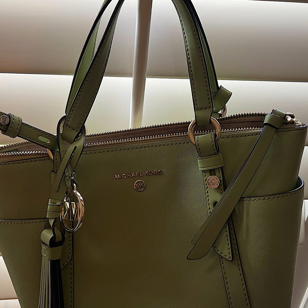 Michael Kors bag.  Like new, great collection.  Unique light green color